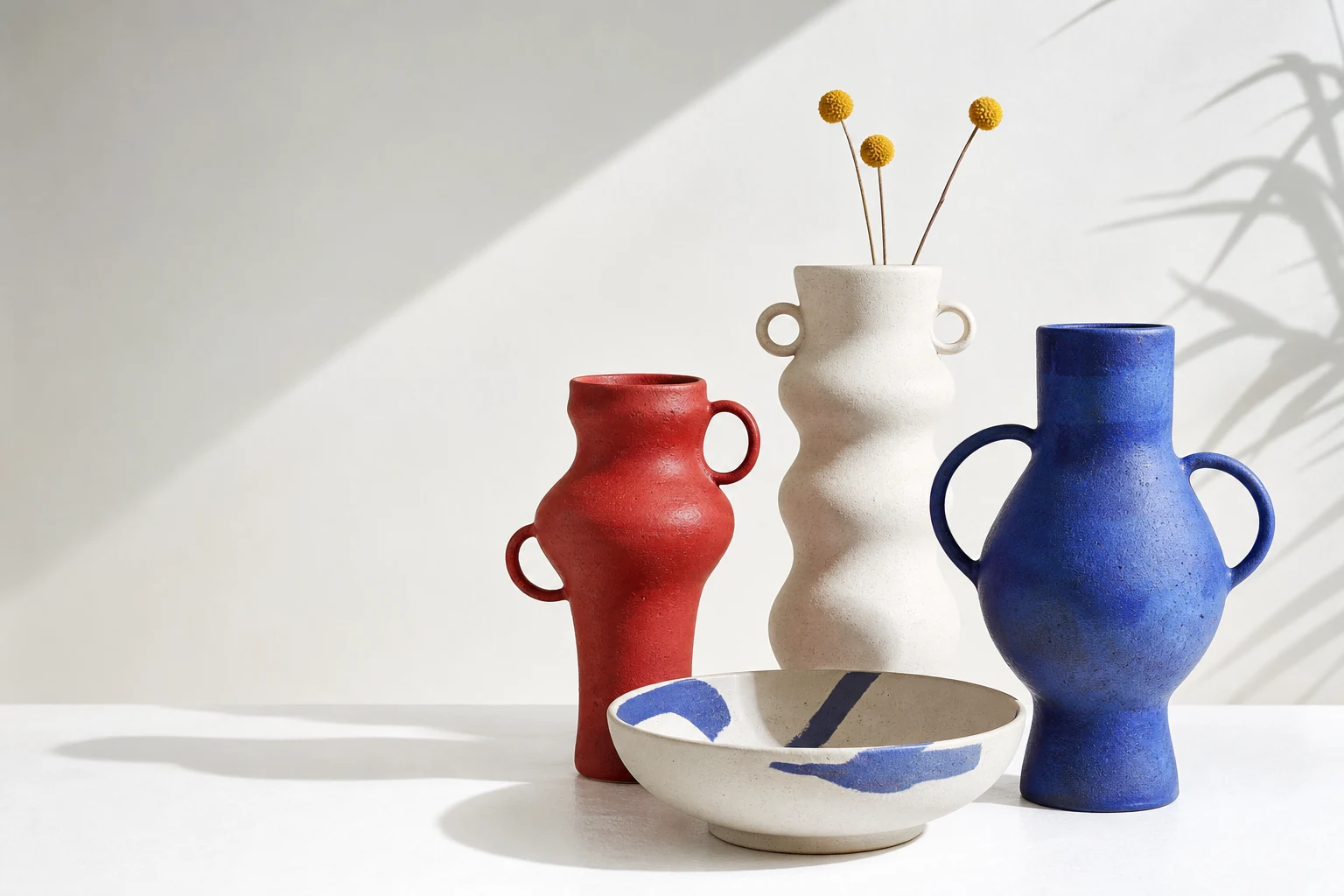 Red loop-handled ceramic vase